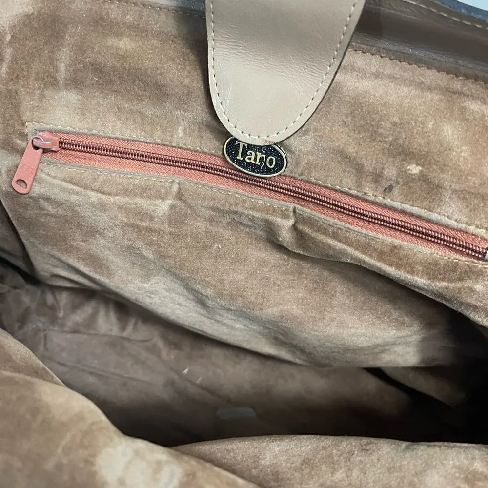 Tano Leather tan frame medium satchel gold tone hardwares .